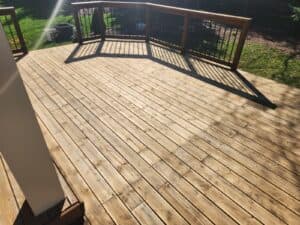 Before and after deck cleaning and staining transformation